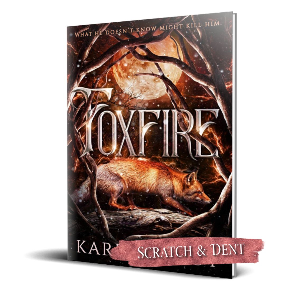 Book cover of 'Foxfire' with a fox and moonlit branches on a dark background; scratch and dent label.