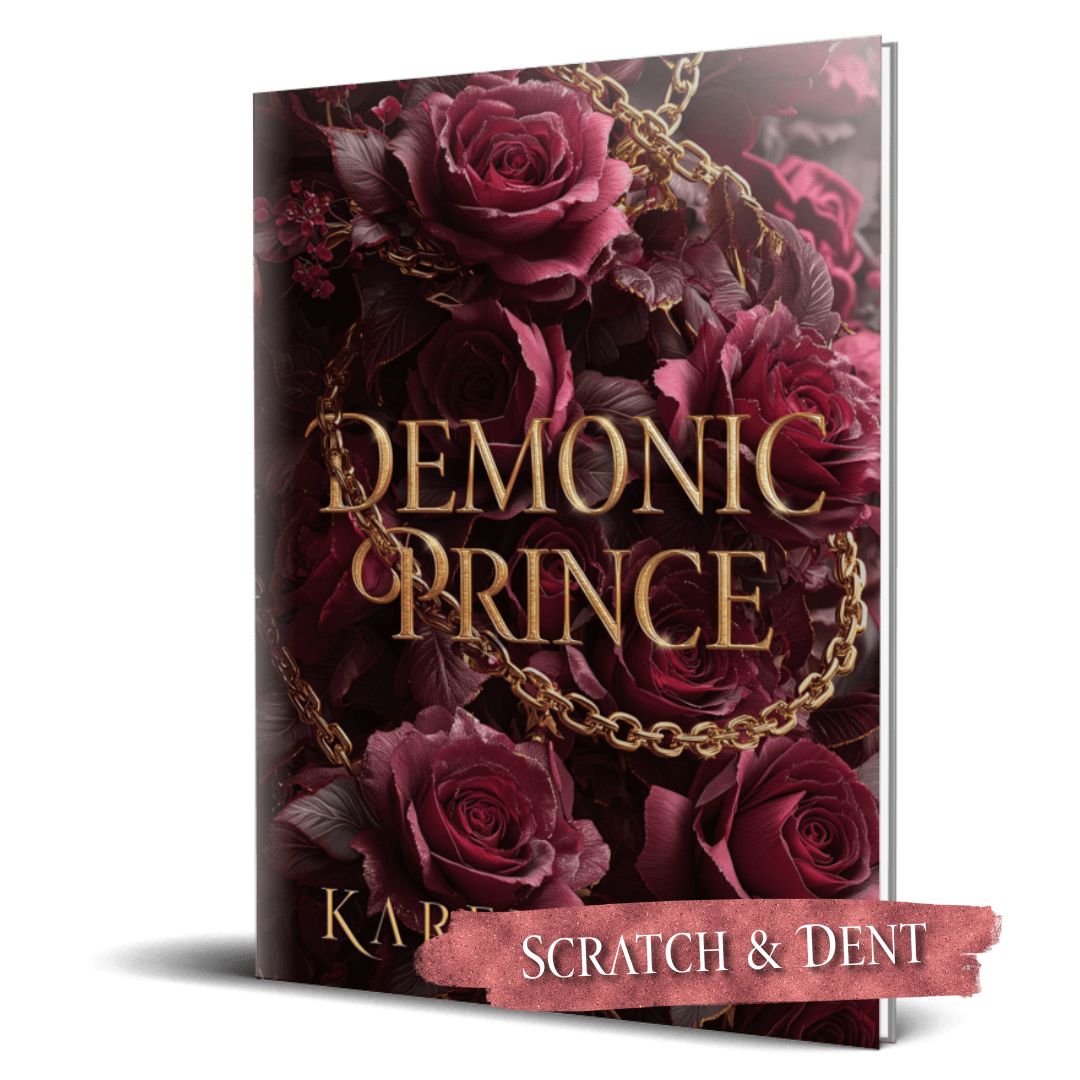 Book cover of 'Demonic Prince' with dark roses and gold chain on a white background; scratch and dent label.