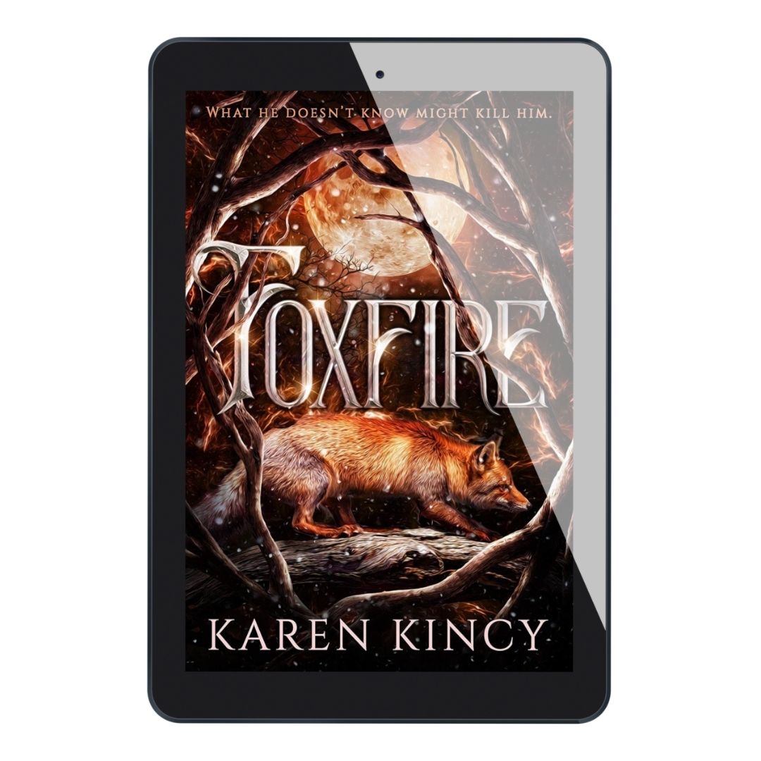 E-reader displaying the cover of 'Foxfire' by Karen Kincy with a fox and tree branch design.