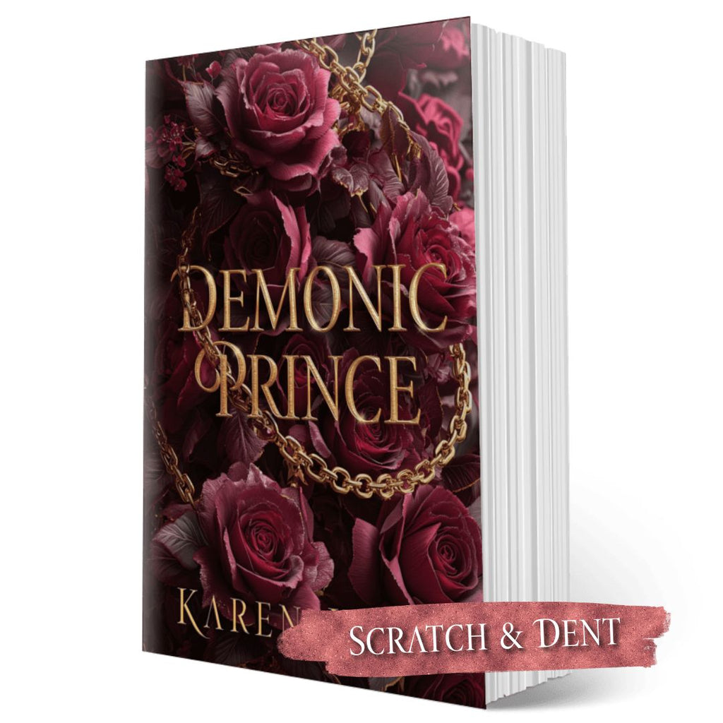Book cover of 'Demonic Prince' with roses and a chain on a white background; scratch and dent label.