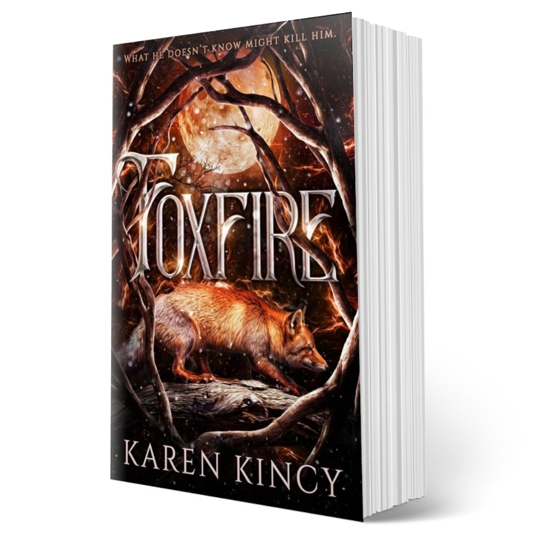 Book titled 'Foxfire' by Karen Kincy with a fox in a forest design on the cover.