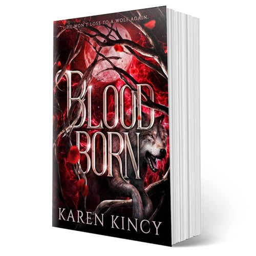 Book titled 'Bloodborn' by Karen Kincy with a wolf and moon design on the cover.