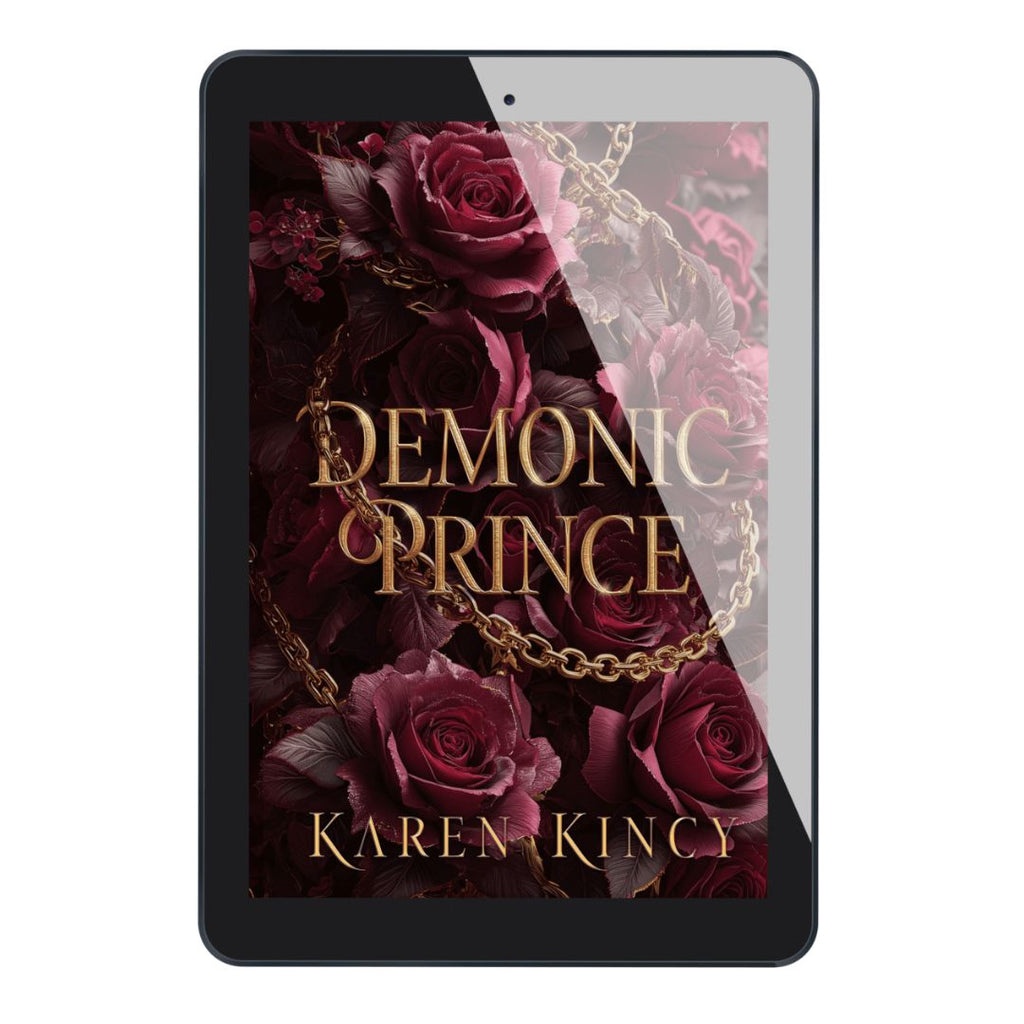 E-reader displaying the cover of 'Demonic Prince' by Karen Kincy with roses and a chain.