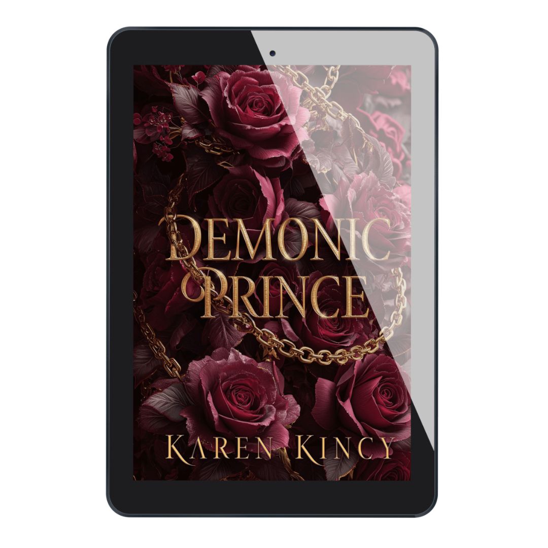 E-reader displaying the cover of 'Demonic Prince' by Karen Kincy with roses and a chain.