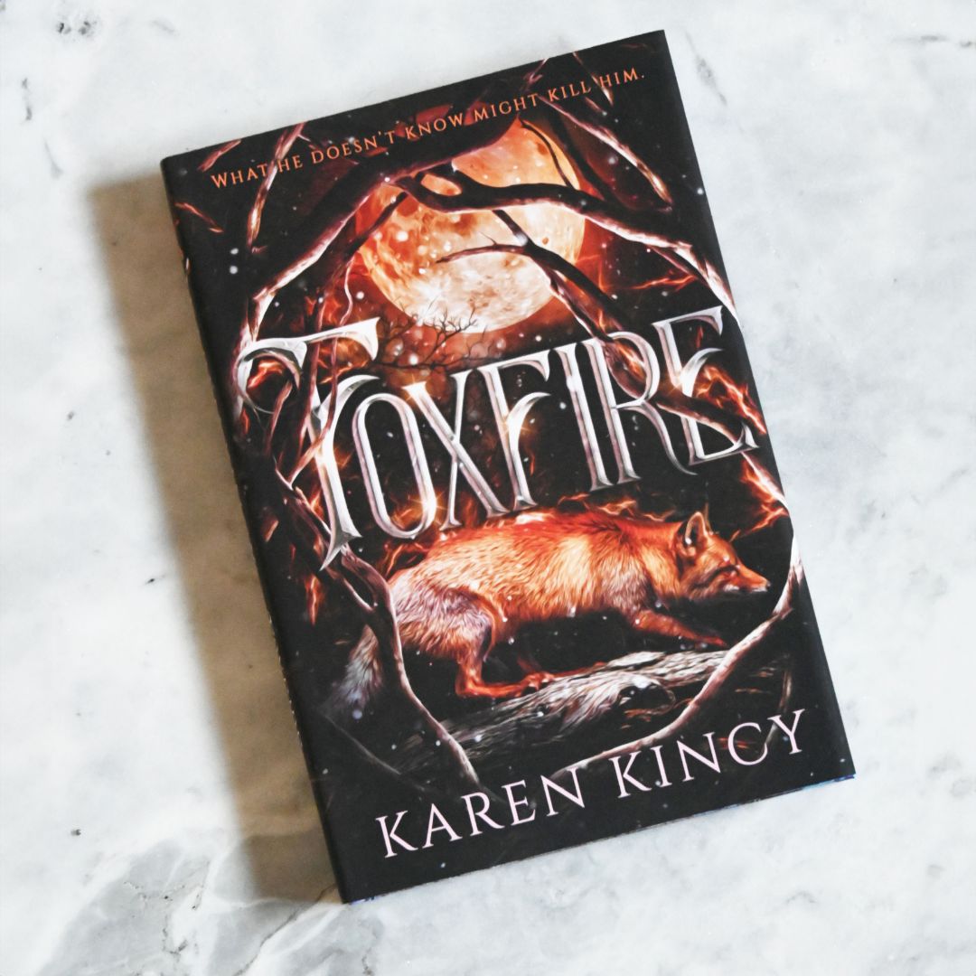 Book titled 'Foxfire' by Karen Kincy on a textured surface