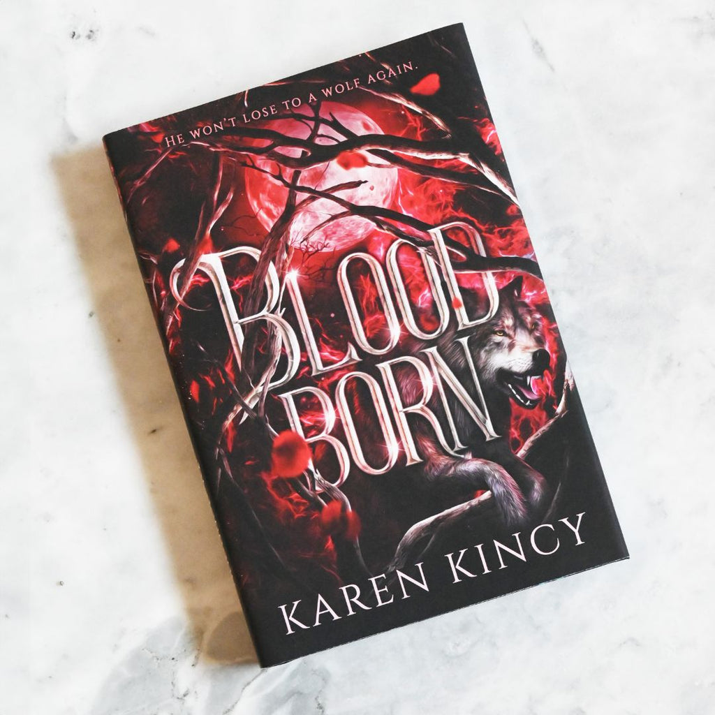 Book titled 'Bloodborn' by Karen Kincy with a wolf illustration on a white background