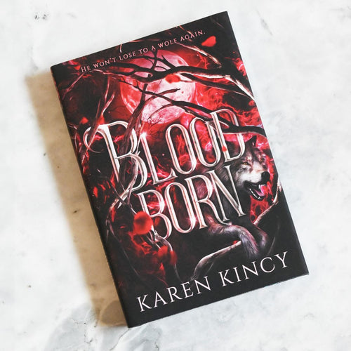 Book titled 'Bloodborn' by Karen Kincy with a wolf illustration on a white background