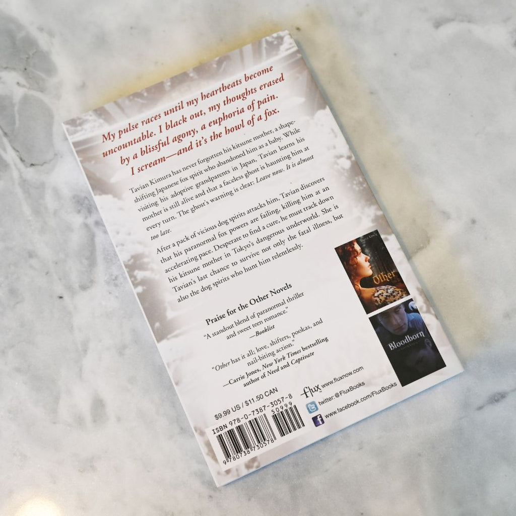 Back cover of a book with text and images on a textured surface