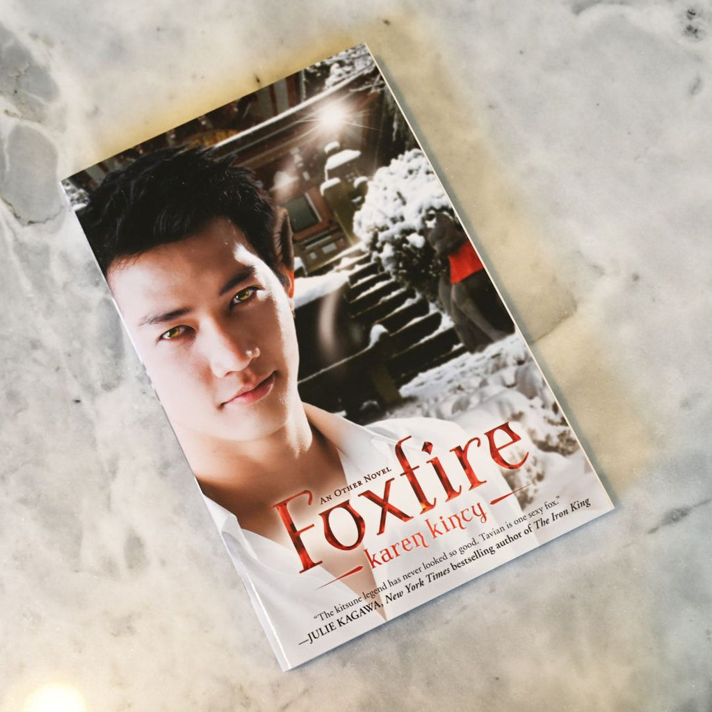 Book titled 'Foxfire' by Karen Kincy on a textured surface