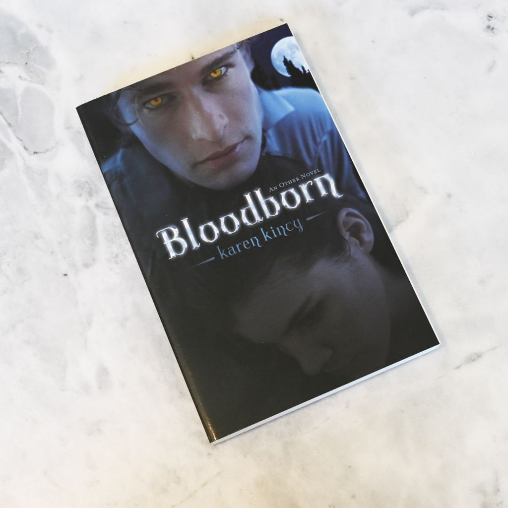 Book titled 'Bloodborn' by Karen Kincy on a textured surface