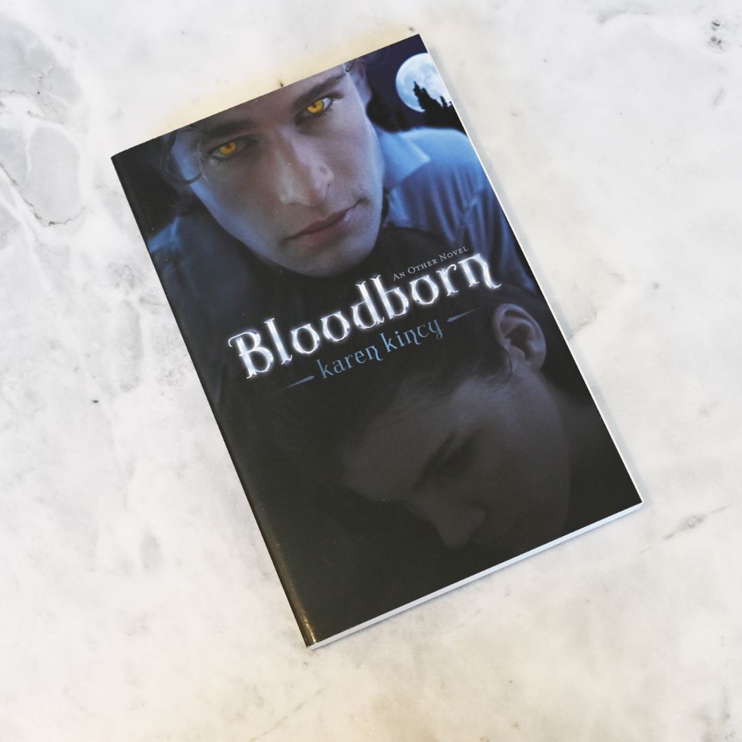 Book titled 'Bloodborn' by Karen Kincy on a textured surface