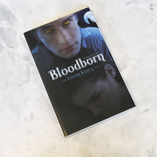 Book titled 'Bloodborn' by Karen Kincy on a textured surface