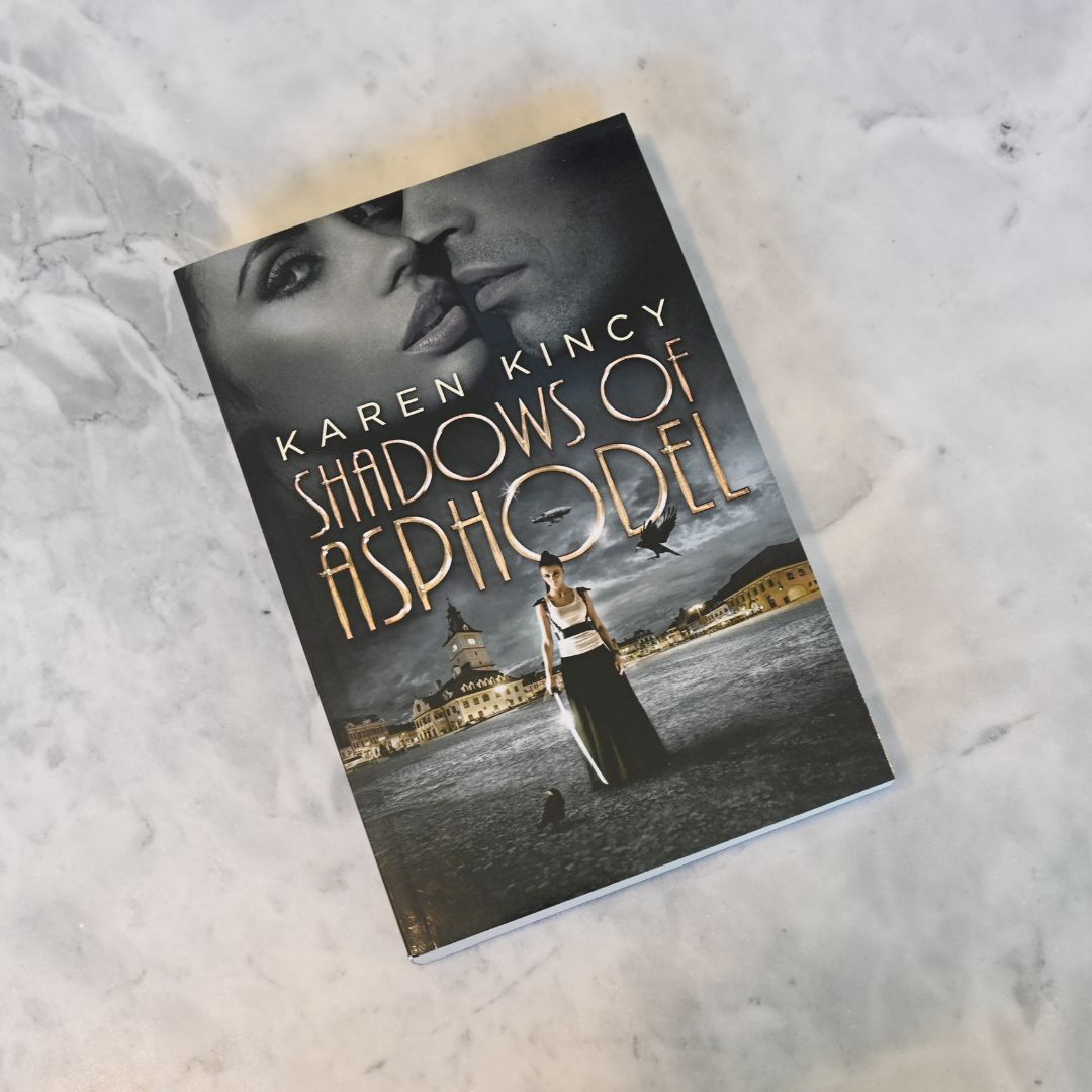 Book titled 'Shadows of Asphodel' by Karen Kincy on a textured surface